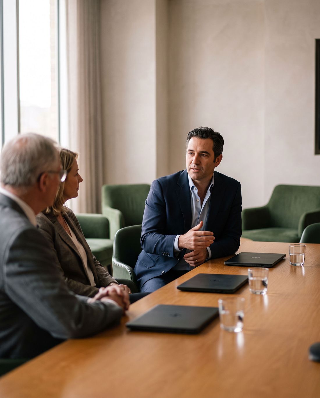 A fractional CFO answering a board member’s question in the boardroom.