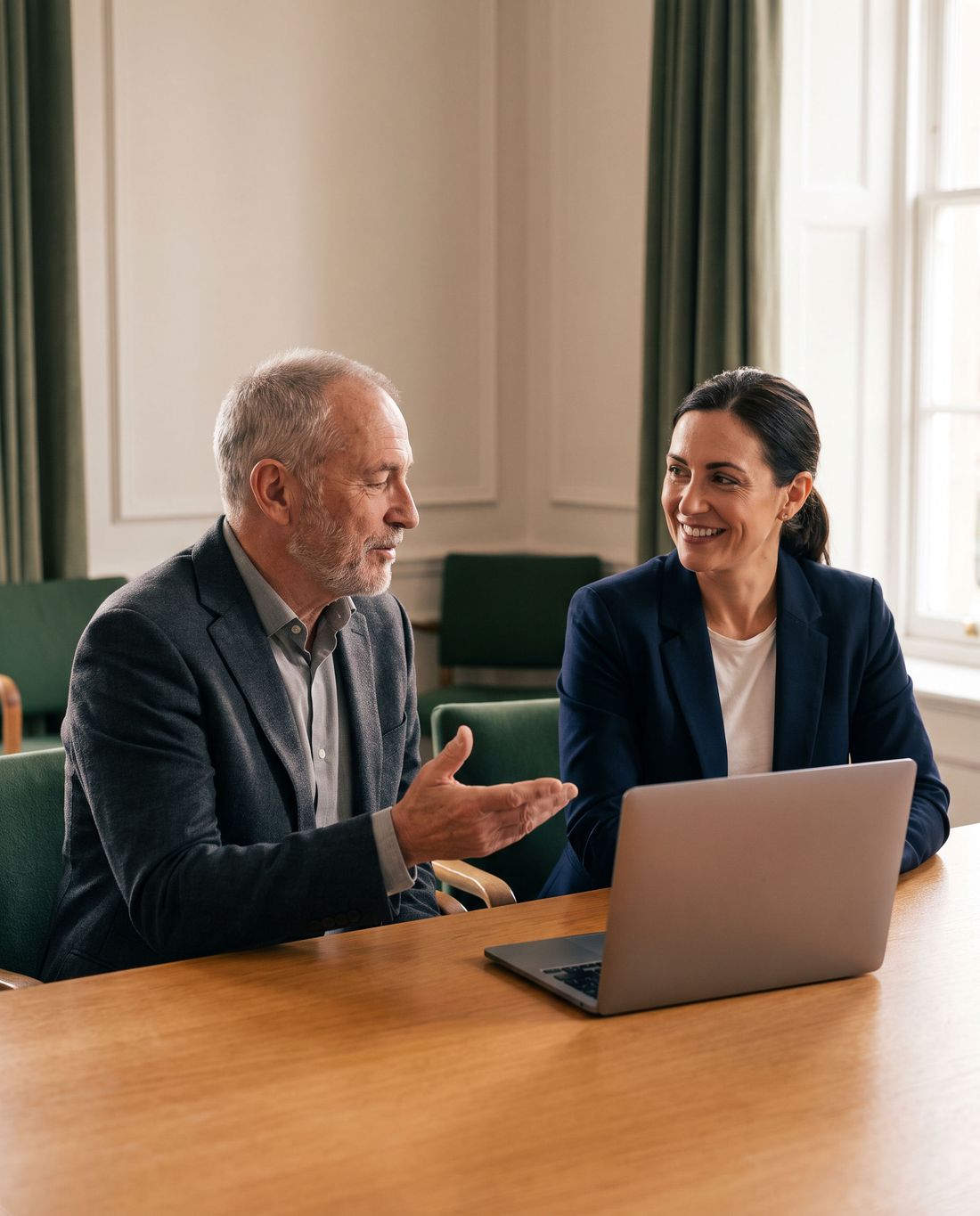 A senior finance executive mentoring a newly hired club controller.